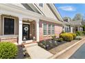 Inviting front porch with brick accents and decorative wreath, creating a warm welcome at 625 Aunt Lucy Sw Ln # 29, Smyrna, GA 30082
