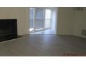 Spacious living room with fireplace and large windows at 4263 Parkview Ct, Stone Mountain, GA 30083