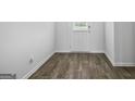 Hallway features luxury vinyl plank flooring and a white door with a window at 744 Great Oak Pl, Villa Rica, GA 30180