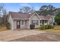 Charming single-story home with gray siding and a well-manicured front yard and drive at 3645 Fay Dr, Rex, GA 30273