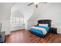 Sun-filled bedroom with vaulted ceiling, hardwood floors, and a built-in window seat at 2024 Oakley Se Trce, Smyrna, GA 30080