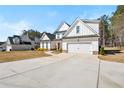 Beautiful two-story home with a spacious driveway, attached two-car garage and well-maintained lawn at 844 Pool Rd, Hiram, GA 30141