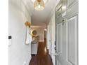 Inviting entryway features hardwood floors, modern light fixture and convenient coat rack by the front door at 2901 Lenox Rd # 1002, Atlanta, GA 30324