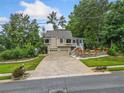 Inviting two-story home with a two-car garage, lovely landscaping, and a welcoming facade at 3278 Winter Wood Ct, Marietta, GA 30062