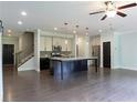 Modern kitchen features stainless steel appliances, large island, and open layout at 257 Stone Park Dr, Woodstock, GA 30188