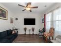 Cozy living room featuring modern ceiling fan and bright natural light at 294 Broder Farms Dr, Stockbridge, GA 30281