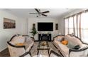 Open living room with elegant furnishings and a large television for entertainment at 294 Broder Farms Dr, Stockbridge, GA 30281
