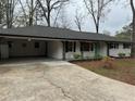 Charming single story home with updated roof, painted brick, decorative porch and mature trees at 4103 Laynewood, Tucker, GA 30084