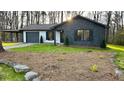 Beautiful home with a black garage, stone facade and well-manicured lawn, creating a welcoming curb appeal at 2265 Hammond Ct, Ellenwood, GA 30294