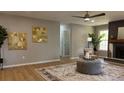 Cozy living room featuring modern decor, elegant fireplace, plush seating, and stylish hardwood floors at 2265 Hammond Ct, Ellenwood, GA 30294