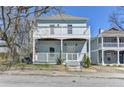 Charming two-story home featuring a welcoming front porch and an upper-level balcony, perfect for enjoying outdoor living at 73 Atlanta Sw Ave, Atlanta, GA 30315