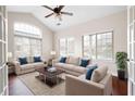 Bright living room with hardwood floors, vaulted ceilings, and large windows at 120 Chastain Nw Rd # 1204, Kennesaw, GA 30144