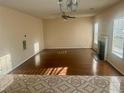 Spacious living room with a fireplace, hardwood floors, and ample natural light at 1909 Sawgrass Dr, Hampton, GA 30228