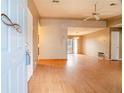 Bright and airy living room with hardwood floors and views into the dining area at 2410 Deep Shoals Cir, Decatur, GA 30034