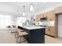 Modern kitchen featuring a large island with seating and stainless steel appliances at 567 Ponce De Leon Ne Ave # 404, Atlanta, GA 30308