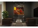 Stylish living room showcasing modern art, comfortable seating, and unique lighting fixtures at 567 Ponce De Leon Ne Ave # 404, Atlanta, GA 30308