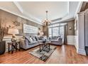 Comfortable living room featuring stylish furniture, large windows, and hardwood floors at 1009 Fairway Seven, Villa Rica, GA 30180