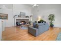 Bright living room boasts hardwood floors, stone fireplace, and an open, airy design at 216 Crescent Moon Way, Canton, GA 30114