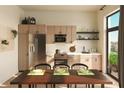 Well-equipped kitchen with modern appliances, a dining table, and a view of greenery at 567 Ponce De Leon Ne Ave # 506, Atlanta, GA 30308