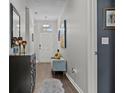 Inviting entryway with hardwood floors, bench seating, and stylish decor at 6028 Providence Dr, Union City, GA 30291