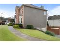 A brick and vinyl sided home with driveway leading to the attached two car garage at 2605 Jacobean Rd, Acworth, GA 30101