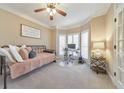 Cozy bedroom with large windows, neutral carpet, a ceiling fan and a versatile daybed at 4073 Hickory Fairway Dr, Woodstock, GA 30188