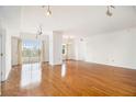 Spacious living room features hardwood floors, natural light, and open floor plan at 195 14Th Ne St # Ph 306, Atlanta, GA 30309