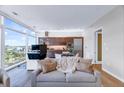 Modern living space with floor-to-ceiling windows offering stunning city views and an integrated kitchen at 45 Ivan Allen Jr Nw Blvd # 1704, Atlanta, GA 30308