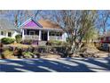 Unique home boasts a quaint front porch, creating a welcoming entryway at 885 White Sw St, Atlanta, GA 30310