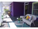 Relaxing porch seating area is furnished with comfortable outdoor seating at 885 White Sw St, Atlanta, GA 30310