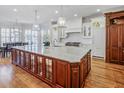 Spacious kitchen featuring a large center island, stainless steel appliances, and custom cabinetry at 3594 Tuxedo Nw Ct, Atlanta, GA 30305