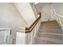 Classic staircase with carpeted steps and a wooden handrail adds charm to this multi-Gathering home at 1156 Piedmont Ne Ave # B3, Atlanta, GA 30309