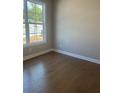Bright bedroom with hardwood floors, a large window and neutral paint color at 274 Lakeside Pl, Canton, GA 30114