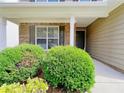 Inviting front porch with manicured bushes and classic brick facade at 1421 Gates Se Cir, Atlanta, GA 30316