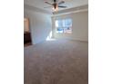 Bright bedroom featuring a large window and plush carpet at 3198 Allison Cir, Decatur, GA 30034