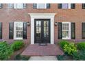 Exterior shot of brick home featuring a double door entry with decorative accents at 4340 Sprucebough Dr, Marietta, GA 30062