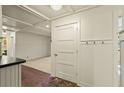 Charming entryway with brick flooring, wainscoting, and coffered ceilings provides a warm welcome at 706 Barrington Hills Dr, Atlanta, GA 30350