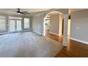 Bright living room featuring hardwood floors and a ceiling fan at 2105 Ector Nw Cv, Kennesaw, GA 30152