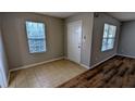 Inviting entryway featuring tile flooring and natural light from the windows at 359 Fourth St, Forest Park, GA 30297