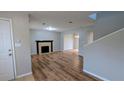 Spacious living room boasts a fireplace and modern flooring at 359 Fourth St, Forest Park, GA 30297