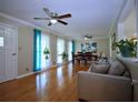 Spacious living area featuring hardwood flooring, large windows, and great natural light at 5235 Pounds S Dr, Stone Mountain, GA 30087