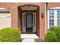 Close-up of the front door with sidelights, showcasing the brick facade and well-maintained entrance at 4664 Prater Se Way, Smyrna, GA 30080