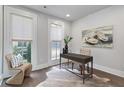 Cozy office space with a modern desk, unique chair, and large windows at 574 Boulevard Ne Pl # 14, Atlanta, GA 30308