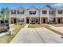 Charming townhouse featuring brick accents and a concrete driveway at 6036 Oakley Rd, Union City, GA 30291