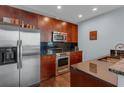 This sleek kitchen features stainless steel appliances and granite countertops at 400 W Peachtree Nw St # 2604, Atlanta, GA 30308