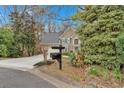 Charming home featuring a two-car garage, a wide driveway, and beautiful architectural details at 931 Cornwall Sw Ct, Marietta, GA 30064