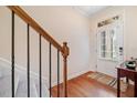 Inviting foyer with hardwood floors, staircase, and white door with glass accents at 2105 Caswell Cir # 185, Marietta, GA 30060