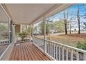 Inviting front porch featuring a warm wood deck and views of the neighborhood at 12 Remington Ct, Euharlee, GA 30145
