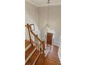 View of the staircase, foyer, and entryway with chandelier at 210 Chiswick Close, Johns Creek, GA 30022