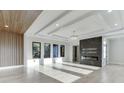 Bright, modern living room with hardwood floors and a sleek fireplace feature at 2329 Walker Dr, Lawrenceville, GA 30043